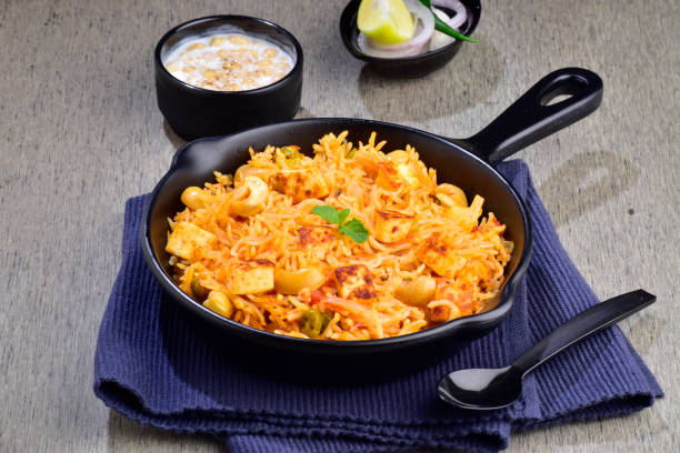 istock Vegetable pulao served with raita in plate 1501040383