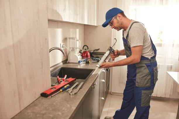 istock Handyman fixing kitchen cabinets in the apartment. 1501043512