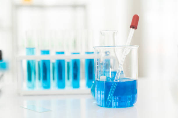 istock Glasswares objects and microscope in laboratory. Science and education. Scientific experiment, Researcher, Research concept 1501047170