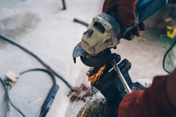 istock Metal working man hand steel grinder 1501052081