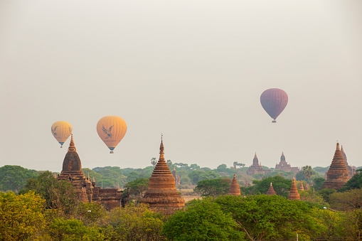 Bagan, Myanmar - ‎March 10, 2016 : Hot Air Balloons Flying Over Pagodas In Bagan. Bagan Is An Ancient City And A UNESCO World Heritage Site In The Mandalay Region Of Myanmar.