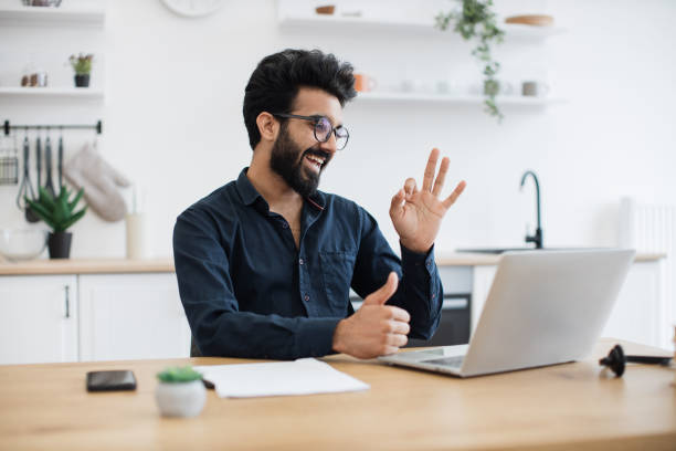 istock Consultant receiving video call via computer in home office 1501055176