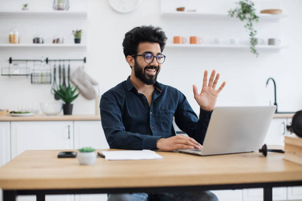 istock Consultant receiving video call via computer in home office 1501055180
