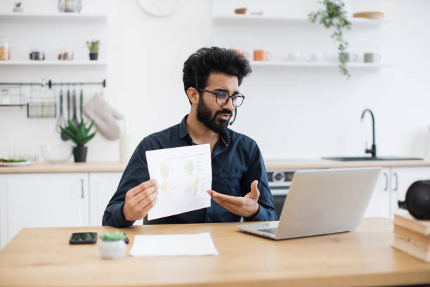 istock Adult giving analysis with graphs via laptop and headset 1501055210