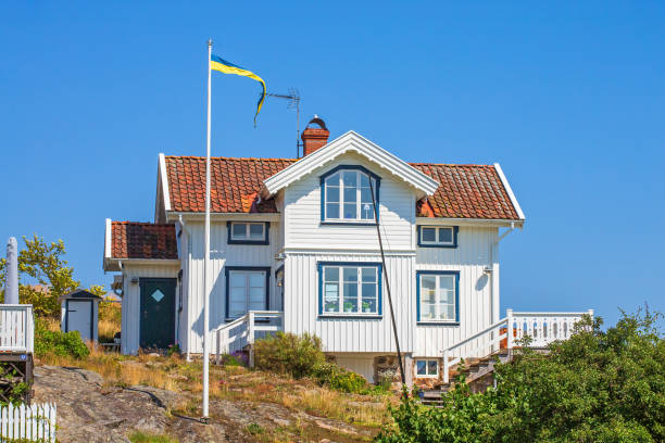 A row of three brightly coloured houses on a hill in Tromso, far northern Norway, above the arctic circle