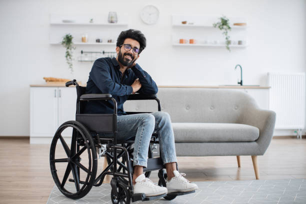 istock Wheelchair user spending pastime at home on sunny day 1501059744