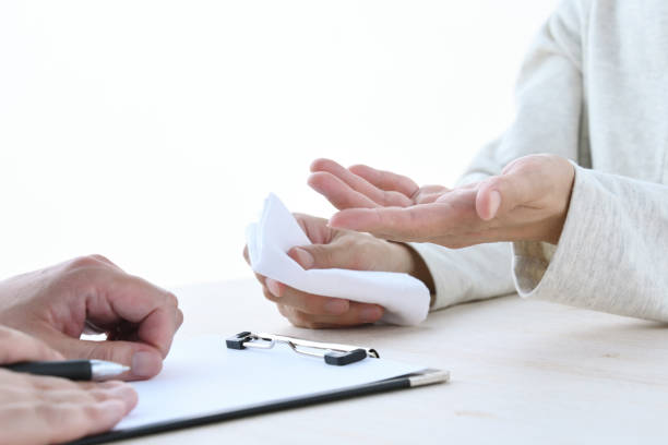 istock Interviewing between doctor and woman with handkerchief 1501060323