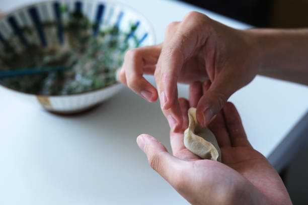 istock hands make Chinese dumpling(jiaozi). Chinese food culture 1501060347