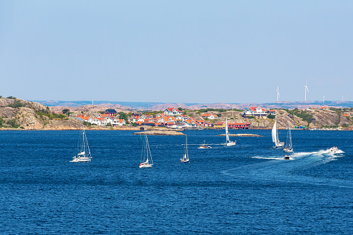 Coast village at the Swedish coastline with boats on the sea