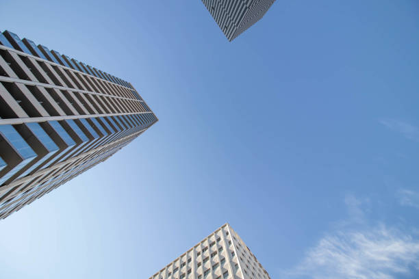 High-rise building photographed from below in the morning with blue sky background with Copy Space or Text Space.