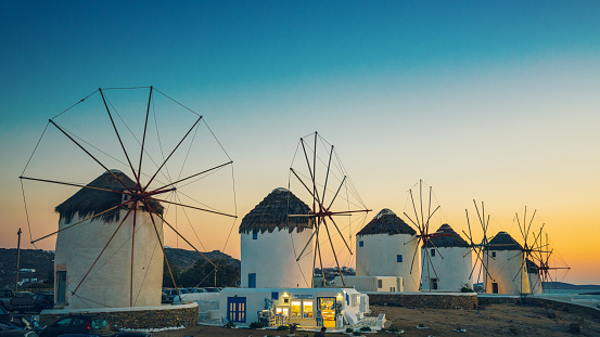 Windmills in Mykonos town (Chora), Mykonos island, Cyclades, Greece at dusk.