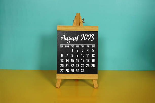 istock monthly calendar on easel stand on yellow and blue background 1501094842