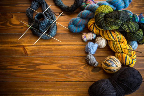 Colored threads, knitting needles and other items for hand knitting stock photo