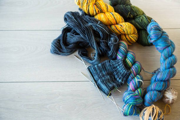 Colored threads, knitting needles and other items for hand knitting stock photo