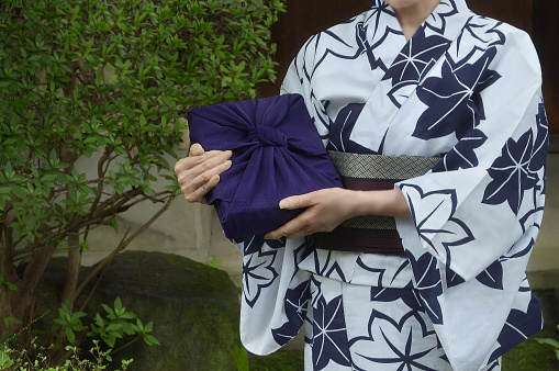 Woman in Yukata Holding Furoshiki Box