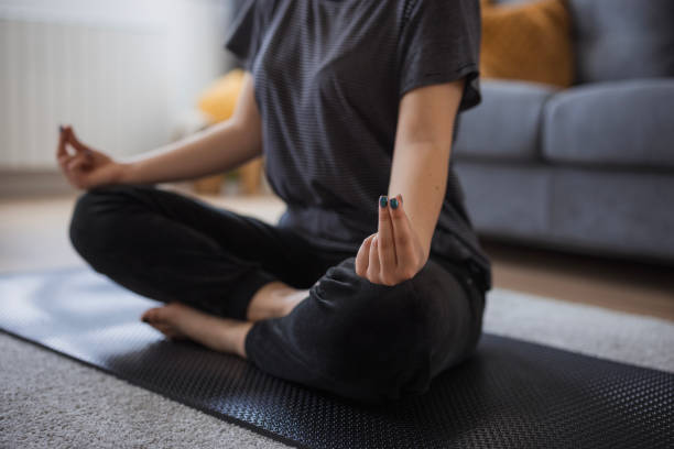 istock Girl doing yoga at home 1501096341
