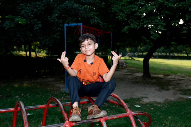 istock Elementary child playing on swing in the park 1501100335