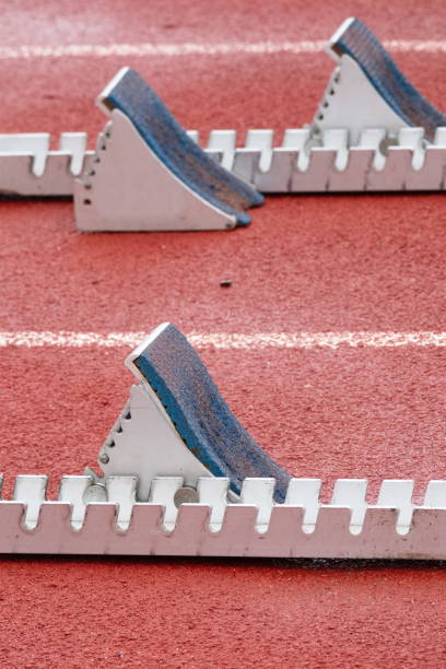 istock Tartan running track for athletic events with starting blocks 1501103324