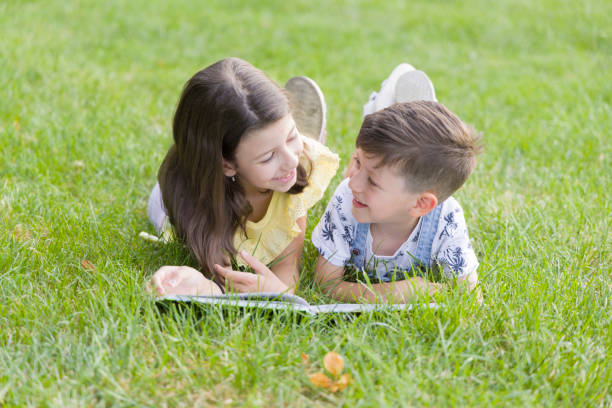 Kids reading book stock photo