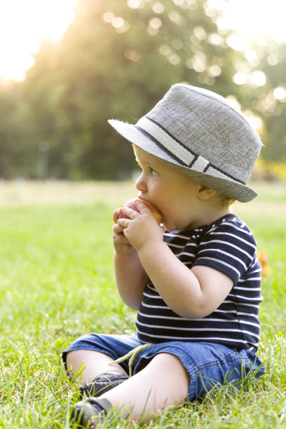 Baby boy outdoors stock photo