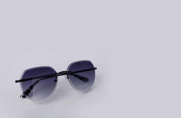 istock gray glasses in a metal frame on a light background, copy space 1501114498