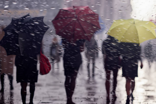 istock backlit motion blurred people on a rainy day in the city 1501124834