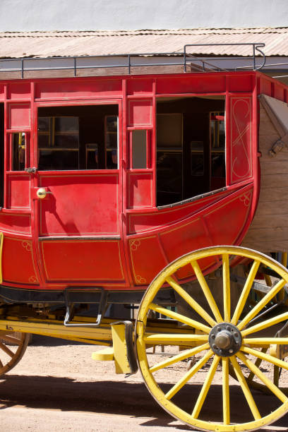 istock Antique stagecoach pulled by a pair of horses on a dirt road 1501127973