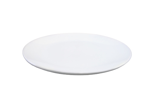 Concept with an empty plate in a modern kitchen, isolated on a white background. Copy space plate for food