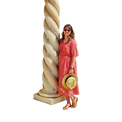 A woman stands next to the twisted spiral columns of a medieval French temple in Carthage, Tunisia, isolated on a white background