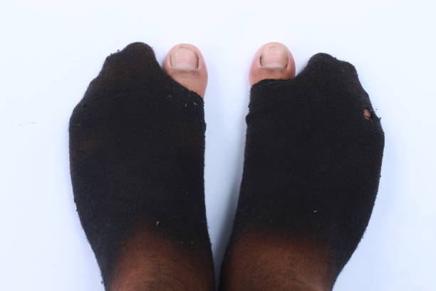 Point of view of man’s feet wearing odd socks