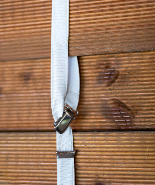 istock a white suspender on a wooden wall 1501130984