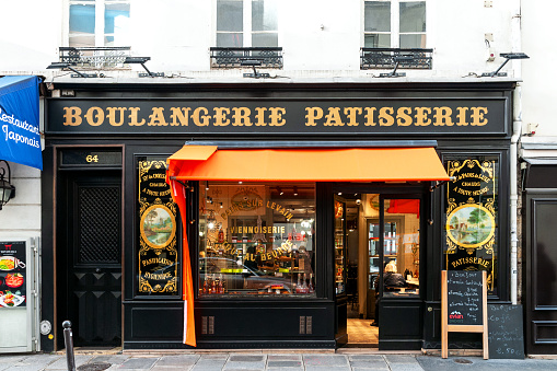 A beautiful Parisian bakery with an old storefront, with golden letters. Paris in France. March 19, 2023