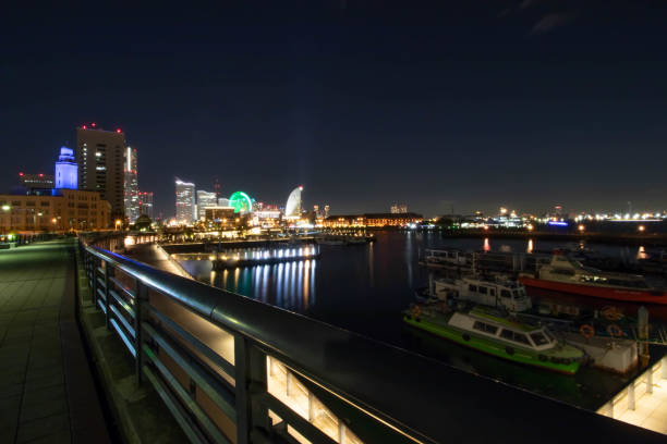 Tokyo, Japan - November 19, 2017: Night photo of Yokohama Port Harbor from bay bridge with long exposure photography