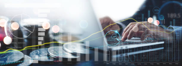 istock Businessman using laptop with financial graph growth chart, analysing business data and market research double exposure with coins and market report. Business, finance and investment, planning and data analysis 1501136152