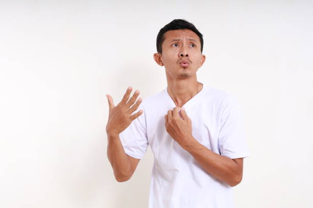 istock Asian funny man felling hot isolated on white background with copyspace 1501138452