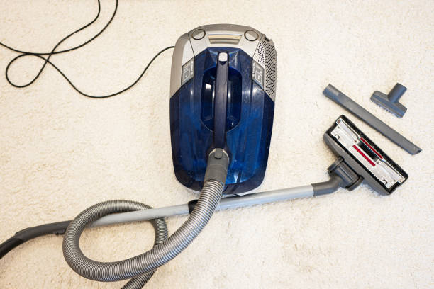 istock Vacuum cleaner on the carpet. Cleaning service concept. 1501140207
