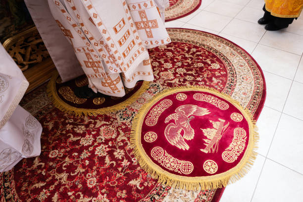 istock Praying with a rosary on a carpet at church. 1501140323