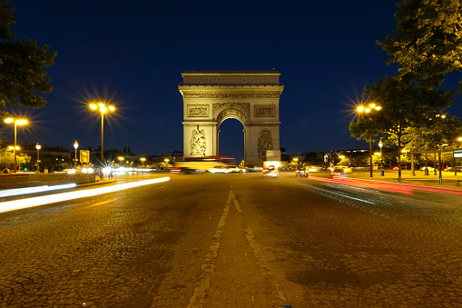 Paris Triumphal Arc at night view Champs-Elysees avenue