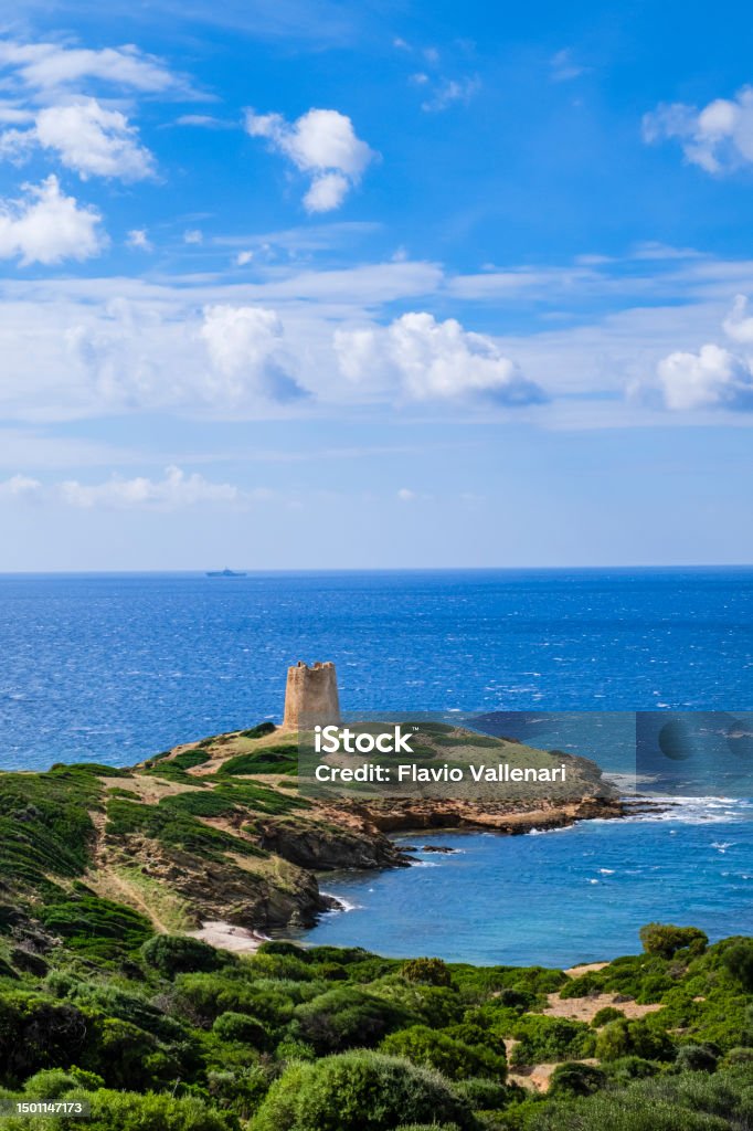 Torre del Pixinnì, watchtower on the coast of Domus de Maria in southwestern Sardinia, Italy Coastal landscape of Domus de Maria at the south-western end of Sardinia, guarded by the Torre del Pixinnì, a watchtower dating back to the sixteenth century Sardinia Stock Photo