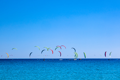 Zanzibar, Tanzania - January 02,2019: Tourists enjoy in kiteboarding on the sandy beaches of Zanzibar.