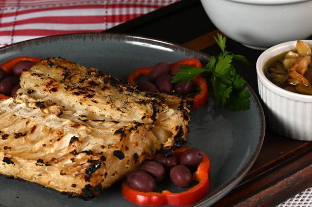 istock typical portuguese dish roasted codfish with onion garlic peppers and rustic babata lusitanian food 1501148051