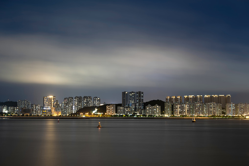 The Night of Modern Urban Residential Buildings by the Sea