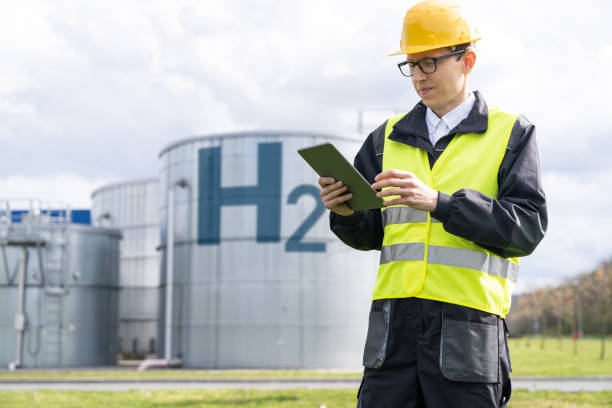 istock Engineer on a background of Hydrogen factory. 1501148491
