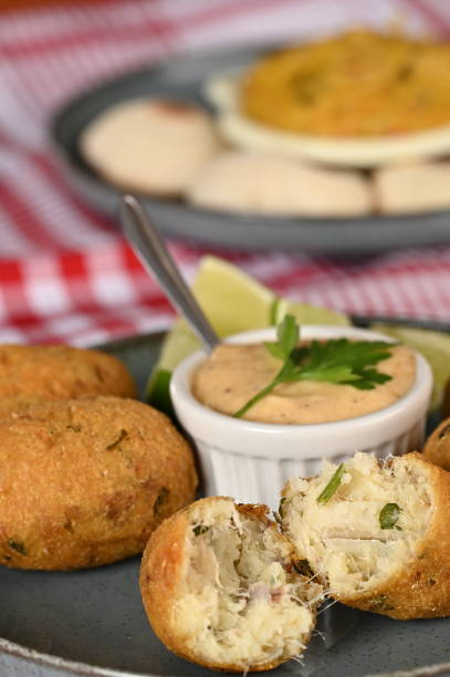 istock Fried codfish fritter typical Portuguese and Brazilian cuisine fish with herbs. 1501149330