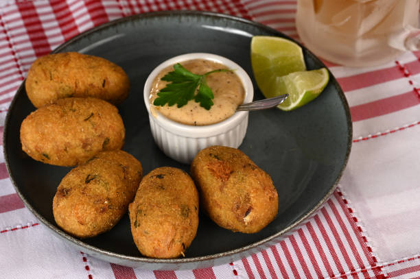 istock Fried codfish fritter typical Portuguese and Brazilian cuisine fish with herbs. 1501149470