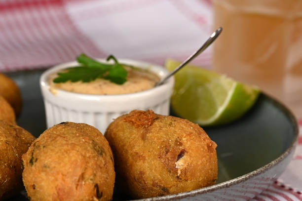 istock Fried codfish fritter typical Portuguese and Brazilian cuisine fish with herbs. 1501149479