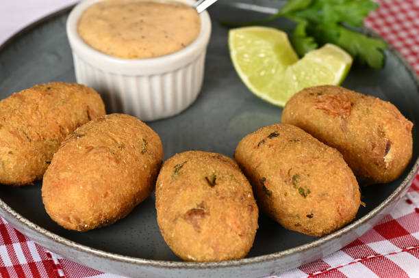 istock Fried codfish fritter typical Portuguese and Brazilian cuisine fish with herbs. 1501149517