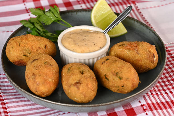 istock Fried codfish fritter typical Portuguese and Brazilian cuisine fish with herbs. 1501149705
