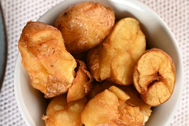 istock rustic potato roasted with garlic and spices snack. 1501149812