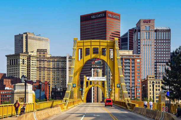 Pittsburghs Yellow bridges cross the river, connecting urban areas and showcasing the skyline.